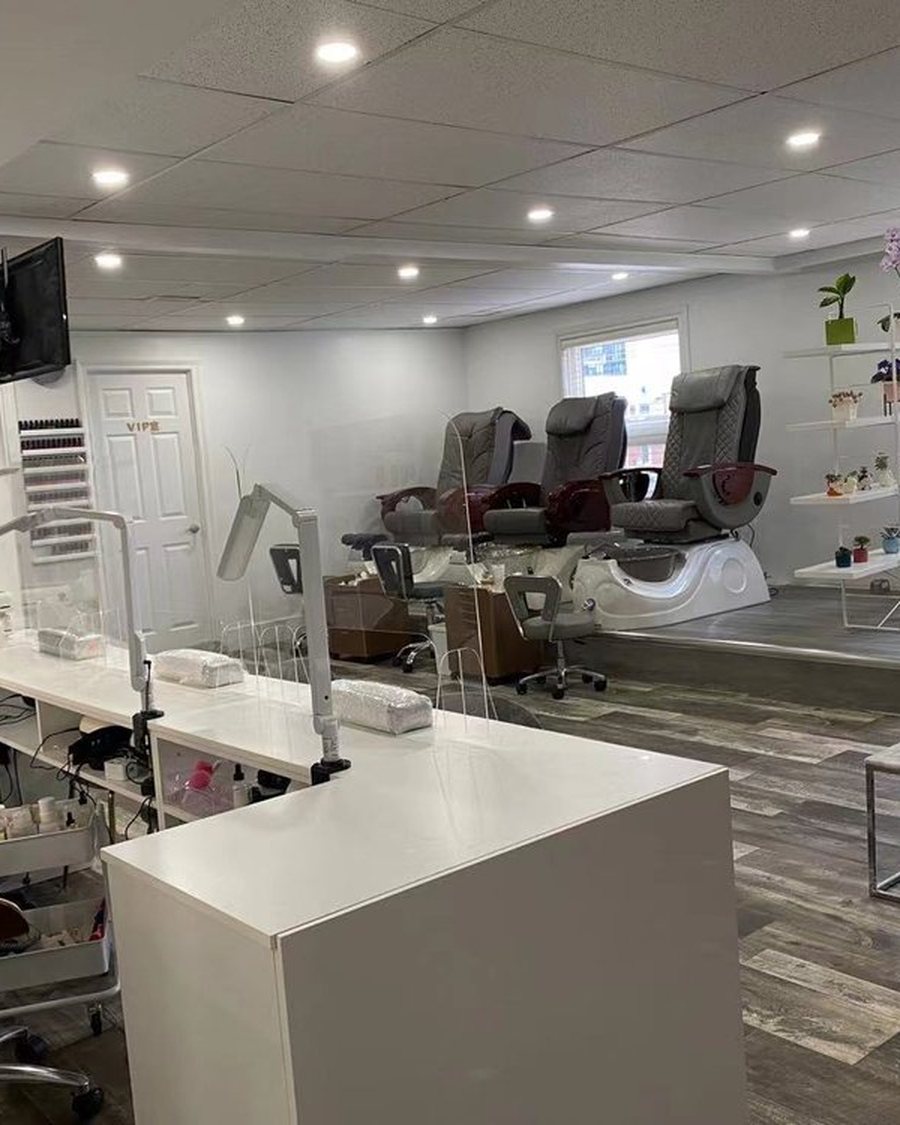 The pedicure area at Mo.Mo Beauty Nails, with plants along the window