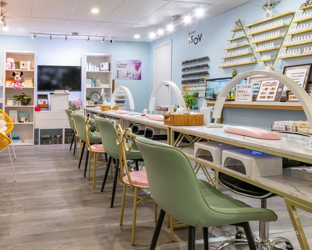 Inside Mo.Mo Beauty Nails — celadon chairs and marble manicure stations on Yonge Street