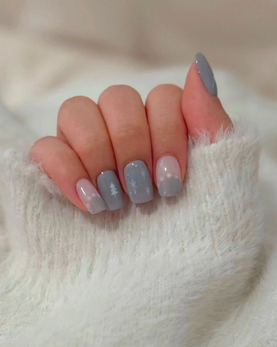 Short grey and blush nails resting on soft wool