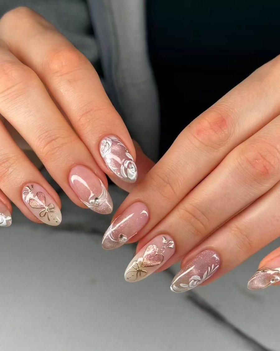 Nude nails with delicate white floral and gold detail