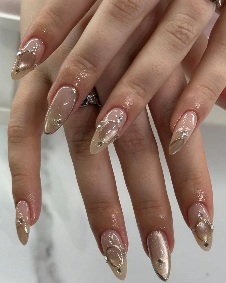 Almond nails with brushed gold tips